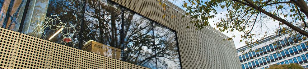 Angle of gold perforated building facade of Advanced Engineering Centre at the University of Brighton