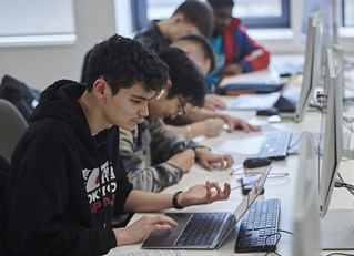 A group of students on laptops