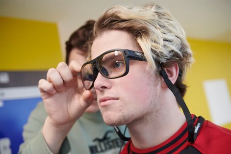 Student wearing eye tracking glasses