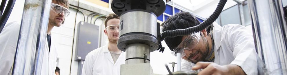 Student working with civil engineering facility for testing concrete