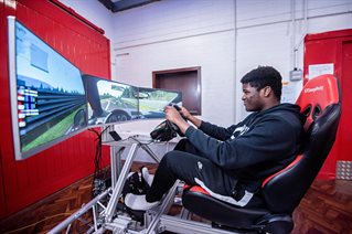 Student driving in car simulator