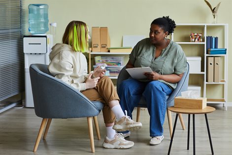 Social worker talking with teenager