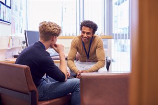 Male student meeting with counsellor discussing mental health issues