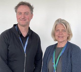 Half length indoor portrait of researchers Professor James Ebdon and Dr Corina Cioran