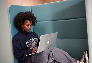 Student on laptop in Elm House