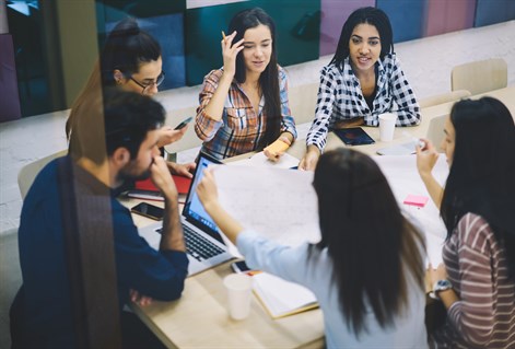 mature students working around table