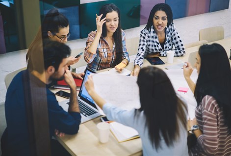 mature students working around table