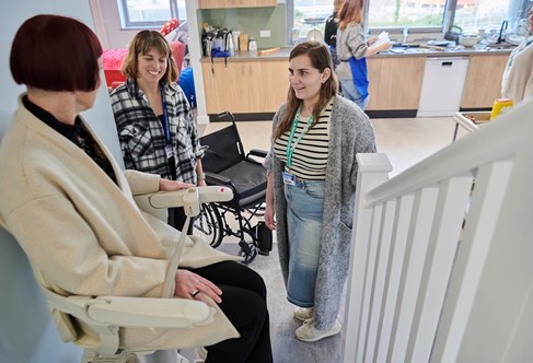 student using the stairlift in our occupational therapy suite