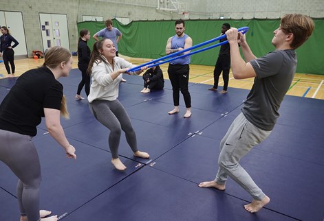 students exercising in the sports hall