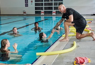 students having a lesson in the swimming pool