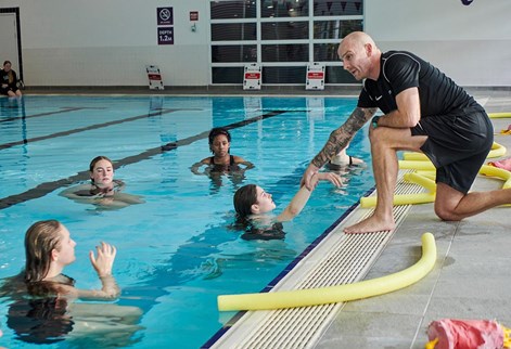 students having a lesson in the swimming pool