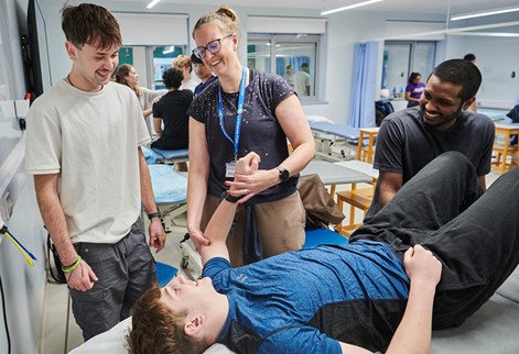 lecturer demonstrating with a student