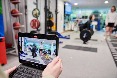 Student analysing in the Strength and Conditioning suite