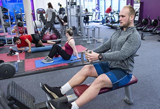 student on rowing machine