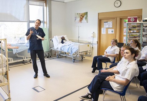 Nursing lecturer teaching in our skills suite