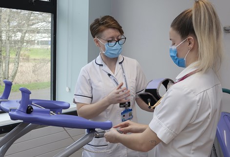 Physio student setting up equipment on placement