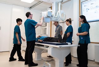 students using the x-ray table