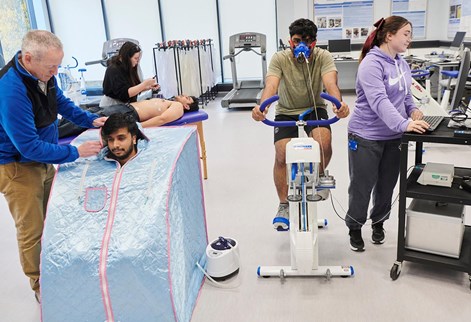 group of students testing on equipment in the labs