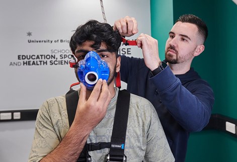 student having a mask fitted