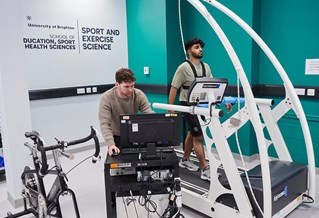 student on running machine in the labs