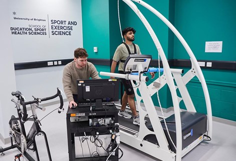 student on running machine in the labs