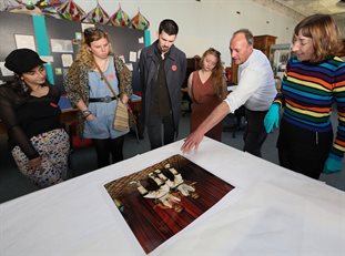 Students and staff discussing the ramifications of a photo