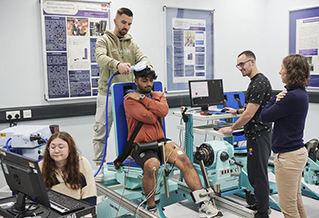 Students using health science equipment