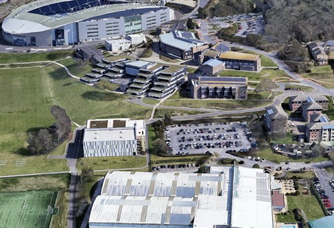 Aerial photo of Falmer campus showing academic buildings, sport facilities and halls of residence