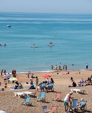 busy Brighton seafront in the summer