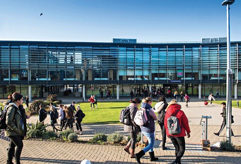 Students outside the Checkland Building at Falmer campus