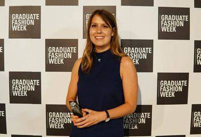 Hannah Gibbins holding the Debenhams menswear award