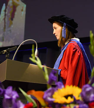 Phoebe Cummings receiving her Honorary Doctorate of Arts at the Brighton Centre