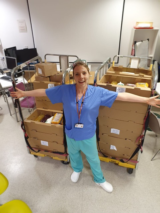 A doctor at London's Royal Hospital receiving our donations of essential grocery packages