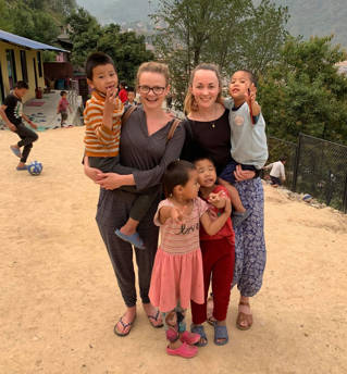 Abi Woodhams with colleague and children orphaned in Nepal's 2015 earthquake